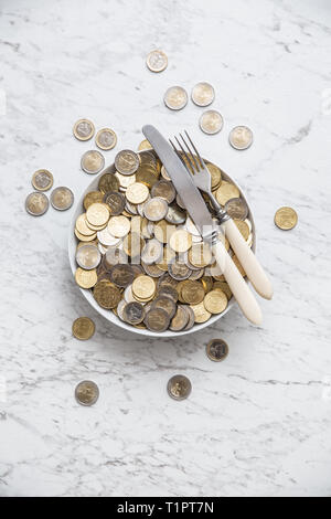 Top of view full plate of euro coins on marble table. Stock Photo
