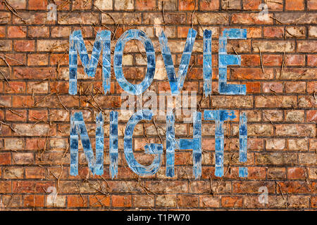 Conceptual hand writing showing Movie Night. Concept meaning tells story and that showing watch on screen or television Brick Wall art like Graffiti m Stock Photo