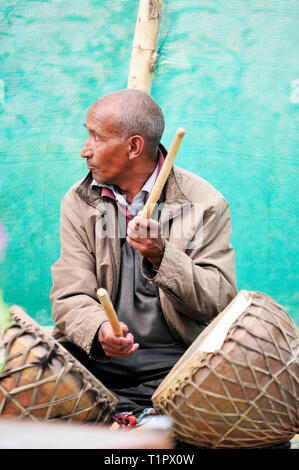 Indian old man playing drums. Ladakh, India © Antonio Ciufo Stock Photo