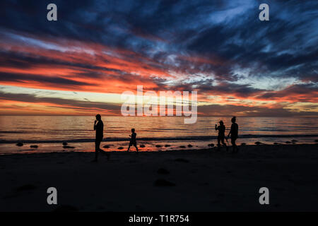 Adelaide, Australia. 28th Mar, 2019. People walk on Grange beach during a beautiful sunset Credit: amer ghazzal/Ģ����ý Live News Stock Photo