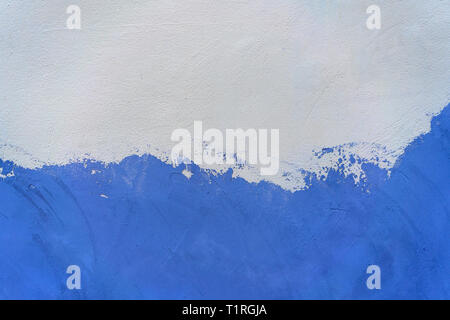 white and blue painted concrete wall. Stock Photo