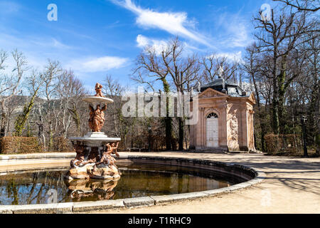 Mar 2019 - La Granja de San Ildefonso, Segovia, Spain - Fuente de Las Tres Gracias in the gardens of la Granja in Winter. The Royal Palace and its gar Stock Photo