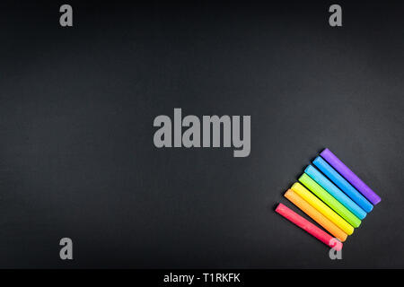 black chalk board with colored chalk for drawing copyspace Stock Photo