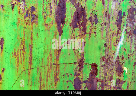 Detail of green painted, old, metal, rusty doors. Grunge texture of green rusty metal with Stock Photo