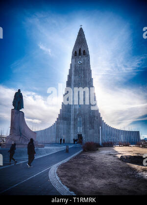 People near amazing Lutheran church in Iceland Stock Photo