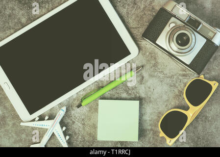 tablet with traveler accessories,travel concept against Grunge background Stock Photo