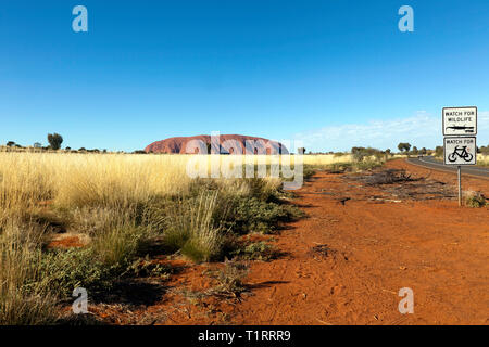 Wide-angle view of Uluru, as viewed from inside the Uluru–kata tjuta National Park, Northern Territory, Australia Stock Photo