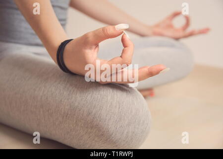Teen Girl Meditating in Turkish Sitting Position Closeup Stock Photo