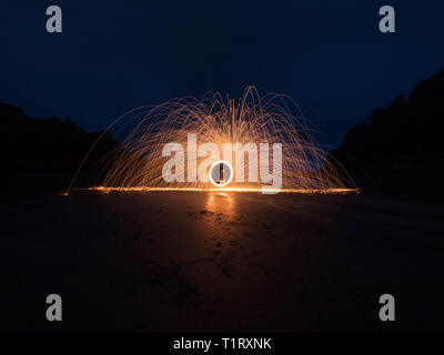 A steel wool shot on the beach at the amazing North Sands in Salcombe. Stock Photo