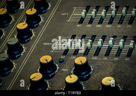 Audio sound mixer console. Sound mixing desk. Music mixer control panel in recording studio. Audio mixing console with faders and adjusting knob. Soun Stock Photo