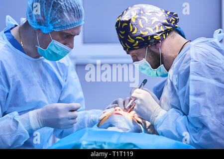 The operation on the eye. Cataract surgery Stock Photo