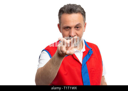 Hypermarket or supermarket male employee with mad expression pointing fingers at camera as watching you gesture isolated on white background Stock Photo