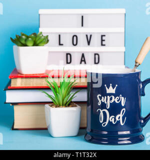 Men's accessory gift for Father's Day - a blue cup with the inscription Stock Photo