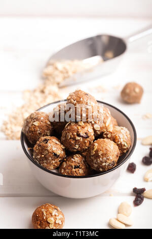If you have a question how to make the no bake energy bites - just mix all ingredients, such as nuts, cocoa, chocolate, oats together in a large bowl  Stock Photo