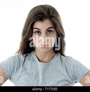 Annoyed irritated young woman with an angry face looking furious, mad and feeling frustrated with someone. Close up studio shot Isolated on white back Stock Photo