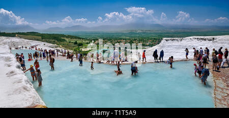 Tourists bathing in the travatine pools oand thermal waters of Pamukkale. Turkey Stock Photo