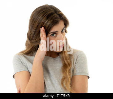 Close up portrait of young woman feeling afraid and shocked hiding her face from something scary. Looking with fear in her eyes. People and Human expr Stock Photo