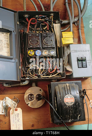 Old obsolete fuse box in the basement of a home Stock Photo