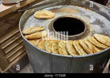 The making bread in tandoor oven Stock Photo