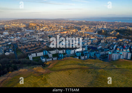 An aerial view of Edinburgh city centre as dawn breaks, taken from Salisbury Crags near Arthur's Seat, Scotland, UK Stock Photo