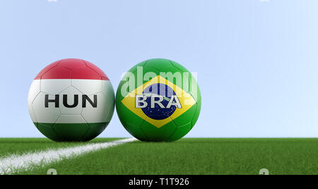 Hungary vs. Brazil Soccer Match - Soccer balls in Hungary and Brazils national colors on a soccer field. Copy space on the right side - 3D Rendering Stock Photo