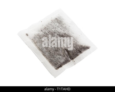 One square teabag conataining English black tea leaves isolated on white background. England UK Britain Stock Photo