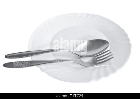 Cutlery - spoon and fork on white porcelain plate isolated on white background Stock Photo