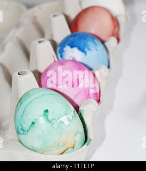 Painted eggs. Paint the eggs for Easter. Marble colored eggs. Pastel shades. Easter eggs. Stock Photo