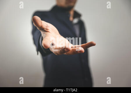 man giving a hand gesture offering help Stock Photo