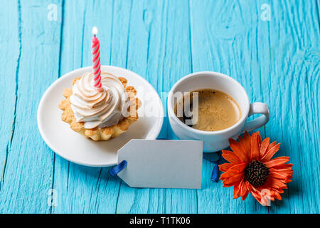 Flower, empty postcard, coffee, cake Stock Photo