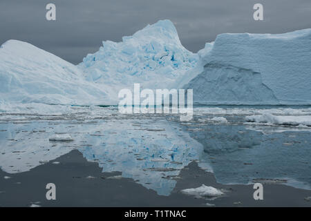 Antarctica. Fish Islands. The Fish Islands are located between Crystal Sound and Grandidier Channel below the Antarctic Circle. Ice reflections. Stock Photo
