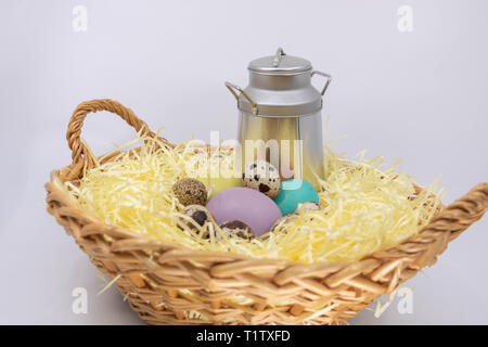 Painted Easter eggs hidden on the farm in fresh produce Stock Photo