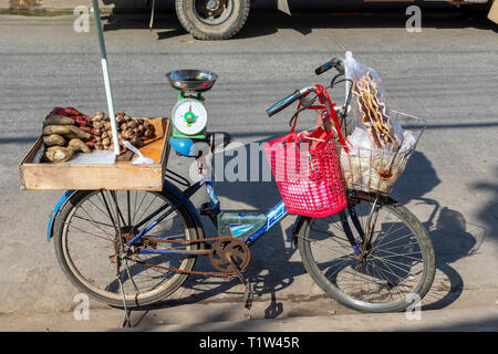 Small amount of potatoes and onions being sold from a bicycle in the old market, Dinh Cau, Pho Quoc Island, Vietnam, Asia Stock Photo