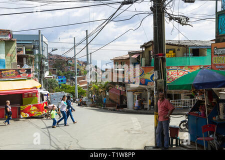 Colombia: Medellin. Pedestrians in the streets of the working-class districts atop the hills overhanging the capital city of the Antioquia Department Stock Photo