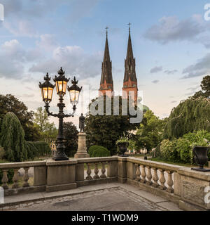 Old lamp post and the Cathedral and Gustavianum in the evening. View from the University park, Uppsala, Sweden, Scandinavia Stock Photo