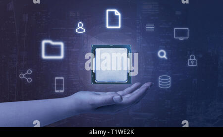 Hand holding processor surrounded with online, computing services icons. Abstract blue background. Stock Photo