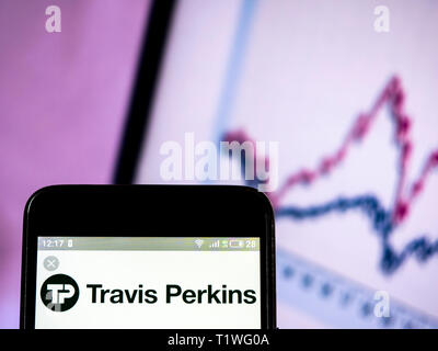 In this photo illustration a Travis Perkins plc logo seen displayed on a smart phone. Stock Photo