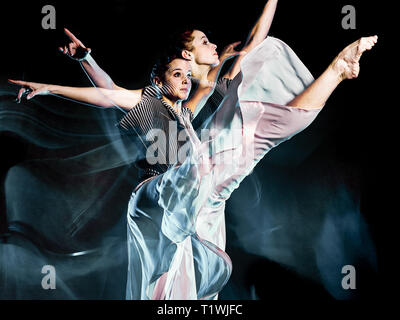 one caucasian woman modern ballet dancer dancing woman studio shot isolated on black bacground Stock Photo