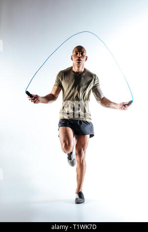 Man jumping with skipping rope during the training Stock Photo