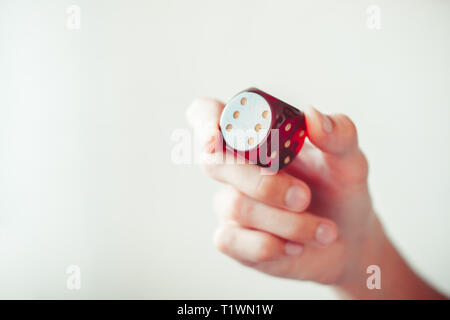 Hand throwing red dices, good luck concept. Stock Photo