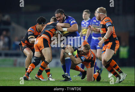 Leeds Rhinos' Konrad Hurrell is tackled by Castleford Tigers' Liam Watts (right), Paul McShane (centre) during the Betfred Super League match at Headingley Stadium, Leeds. Stock Photo