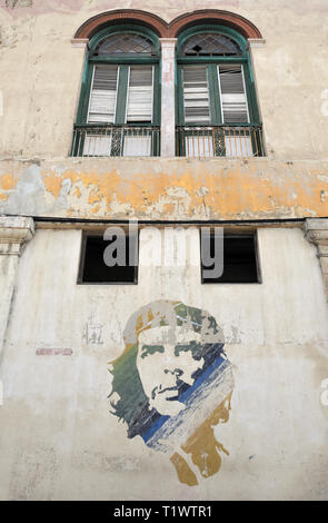 An iconic image of Cuban Revolution figure Ernesto 'Che' Guevara is painted on the wall of a building in Havana, Cuba. Stock Photo