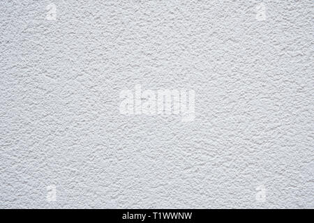color photo of a white wall with rough structure as background picture Stock Photo