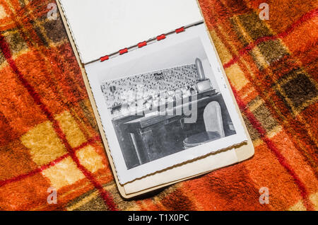 Vintage photograph depicting a basement bar sitting on a tartan blanket Stock Photo