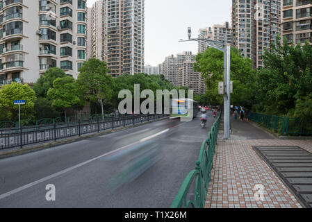 Street traffic and modern buildings in Putuo district. Residential skyscrapers in Shanghai, China Stock Photo