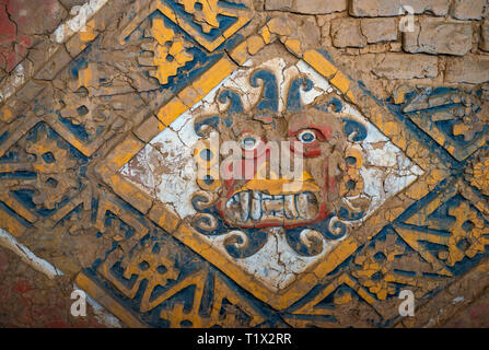 Painted mural bas relief of the creator God Ai Apaec in the Moon Pyramid or Huaca de la Luna built in adobe bricks, Moche civilization, Trujillo, Peru. Stock Photo