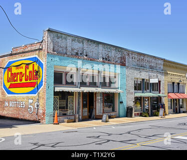 Small town USA stores, shops or storefronts with painted advertising on the building in Alexander City Alabama, USA. Stock Photo