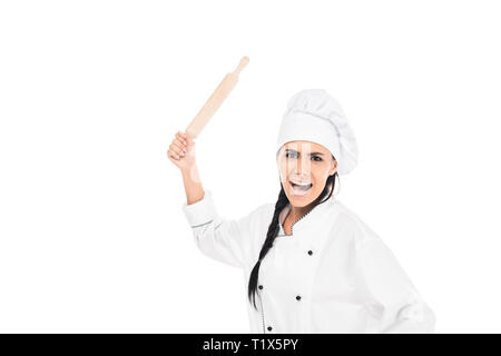 Angry chef in hat holding rolling pin and screaming isolated on white Stock Photo