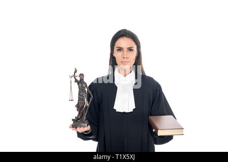 Judge in judicial robe holding themis figurine and book isolated on white Stock Photo