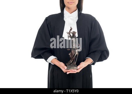 Partial view of judge in judicial robe holding themis figurine isolated on white Stock Photo